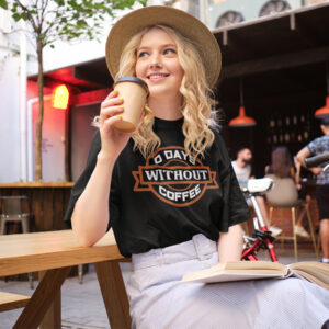 Woman wearing a shirt with '0 Days Without Coffee' printed on it.