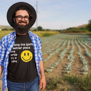 Man in a comfortable-fit T-shirt with the slogan 'Making the world a better place one smile at a time.