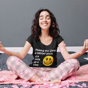 Woman in a stylish tee with the message 'Making the world a better place one smile at a time.